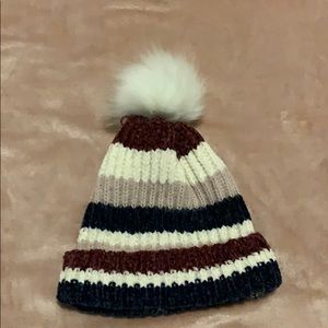 A cute winter hat with a puff ball!